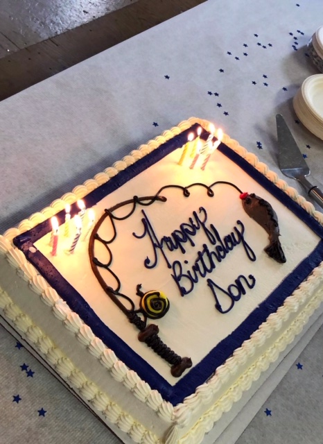 Birthday Cake with a picture of a fishing rod and fish and the words "Happy Birthday Don" written on it